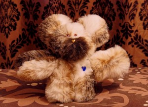 Hand-made teddy bear with heart nose